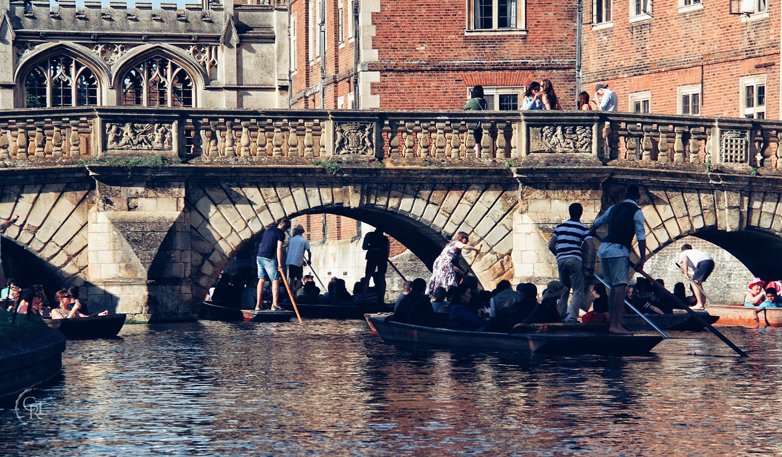 A busy river Cam with Kitchen bridge in the foreground and Sighs in the background